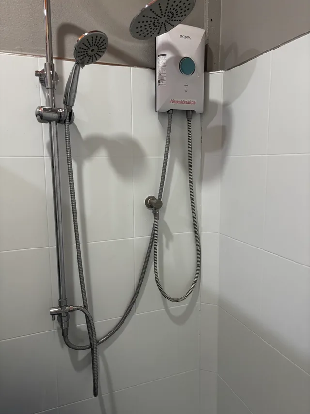 Modern shower with dual rain and handheld shower heads